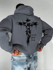 A men's hoodie with the words "Christian faith Overcomes fear" printed on it features a cross-shaped design on the back